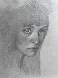 a pencil drawing of a woman's face